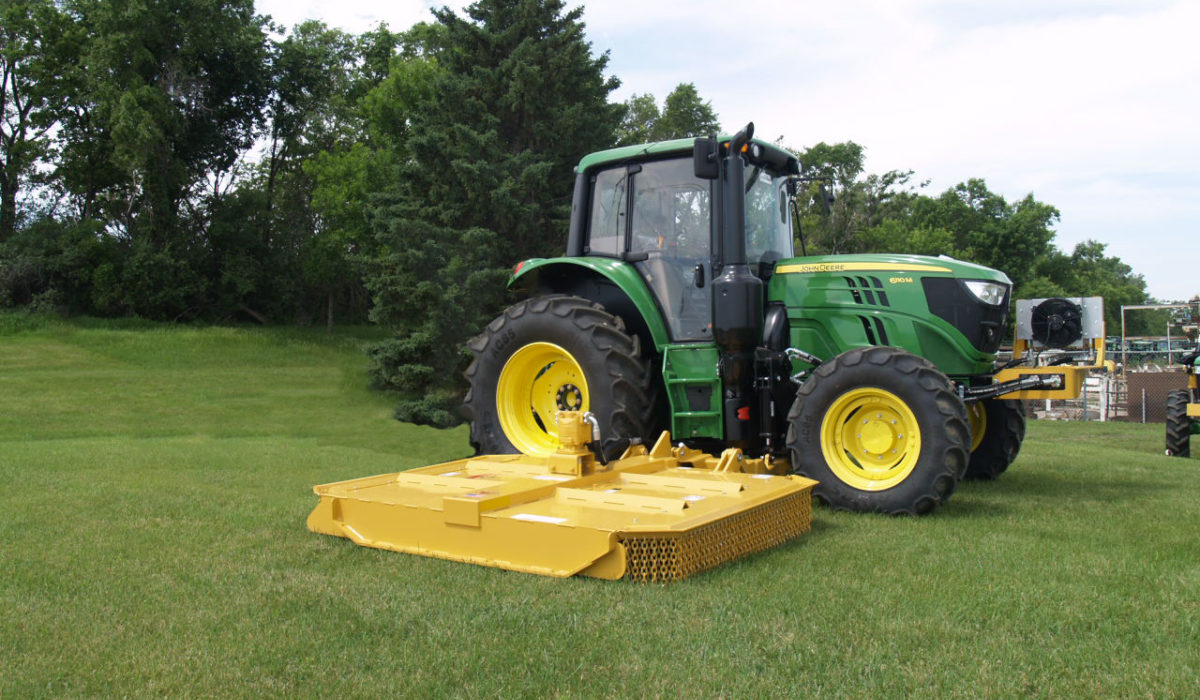 Side mounted mowers for tractors