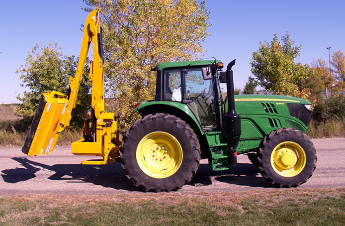 Used tractor with 2024 boom mower for sale